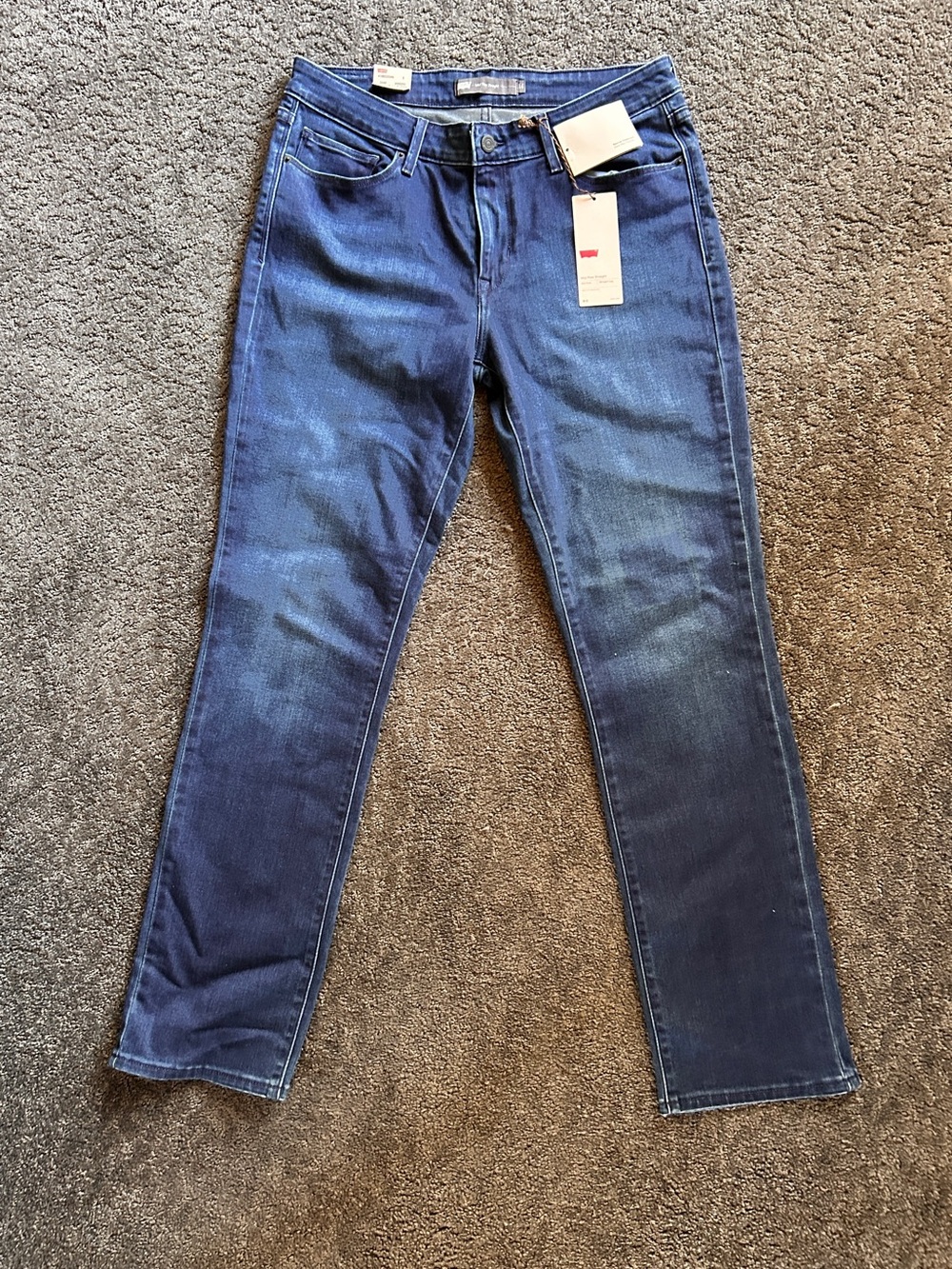 Comfortable, stretchy, Levi's Mid-Rise, Straight Leg Jeans in Dark Blue Wash